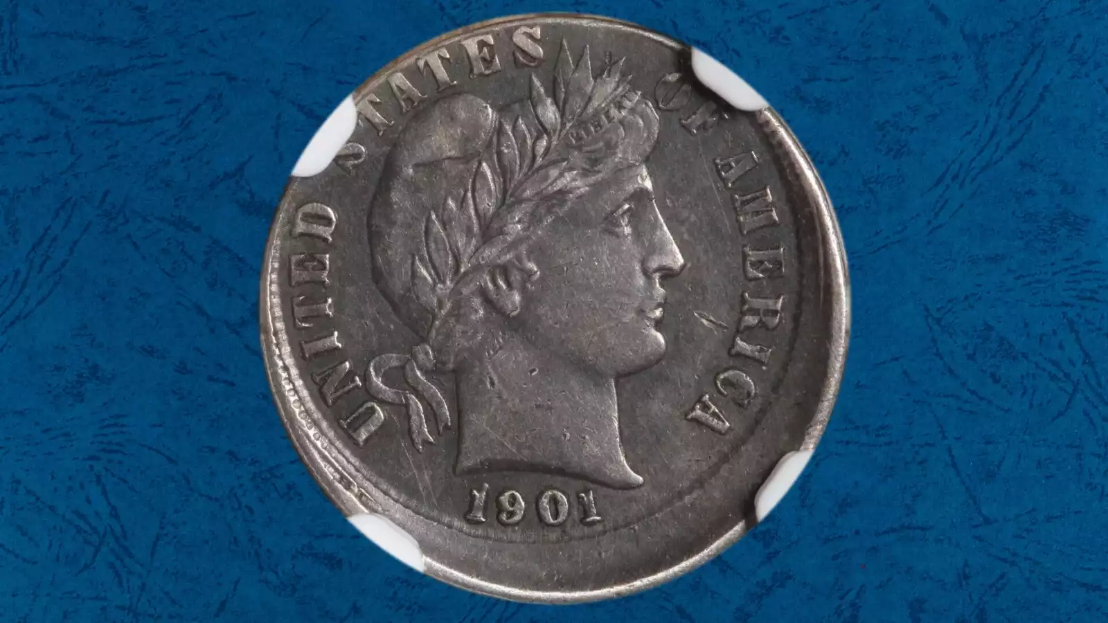 1901 Barber dime off-center strike error showing design displaced from center with visible blank metal crescent and readable date