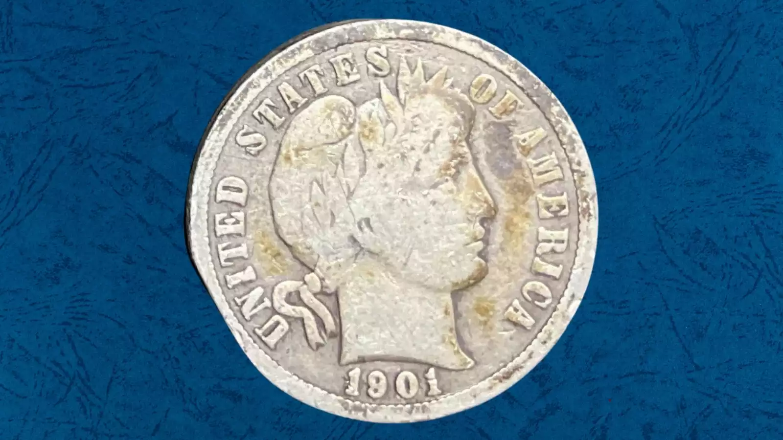 1901 Barber dime clipped planchet error showing a curved crescent clip of missing metal at the edge, illustrating the Blakesley effect